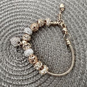 Silver and gold charm bracelet